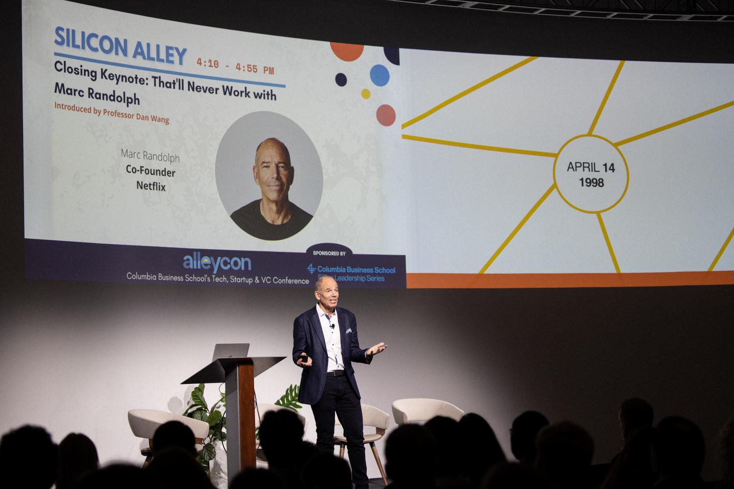 Marc Randolph, co-founder of Netflix, speaking on stage at the Alleycon conference.