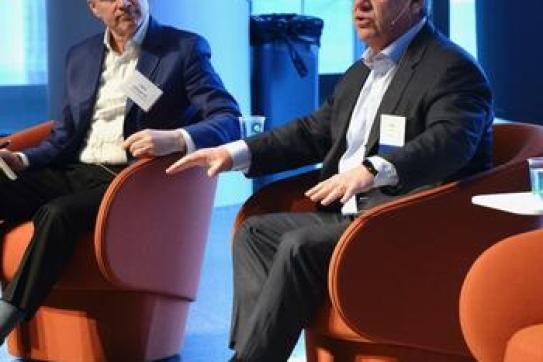 Moderator Mark Gallogly ’86, left, cofounder of Three Cairns Group, and Rich Lesser, global chair of the Boston Consulting Group, speak at the 2022 Climate Business & Investment Conference