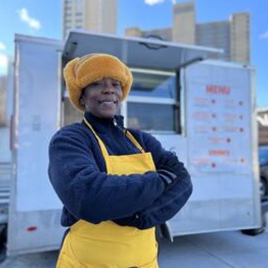 Harlem Local Vendor Program participant Dawn Demry, owner of the Little Hot Dog Wagon, sells her fare everywhere from a food truck outside the Business School to local restaurants and Key Food supermarkets.