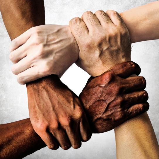 People holding hands. A symbol and concept of unity, teamwork and support.