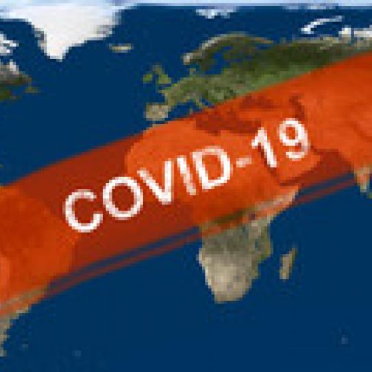 World map superimposed with the words "COVID-19"